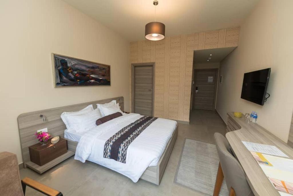 Roots Hotel Apartments Abidjan Bagian luar foto
